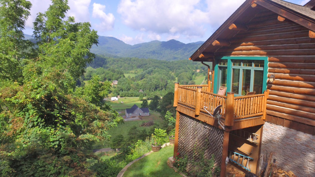 Lush mountain views from the tipi deck. The Blackberry Suite deck is on the right hand side of the photo with windows into the sunroom.