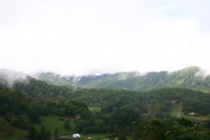 Mountain views with clouds and mostly green color