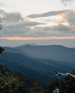 Stunning view of smoky mountains in shades of blue and gray with pink streaking the sky