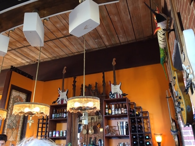 bar with guitars hanging on the ceiling