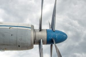 nose of blue and white propeller plane