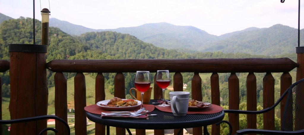 breakfast on outside patio with mountains in distance.