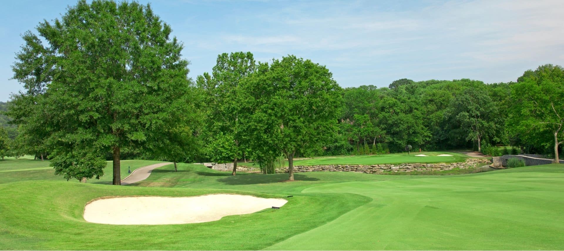 golf course with sand trap and green