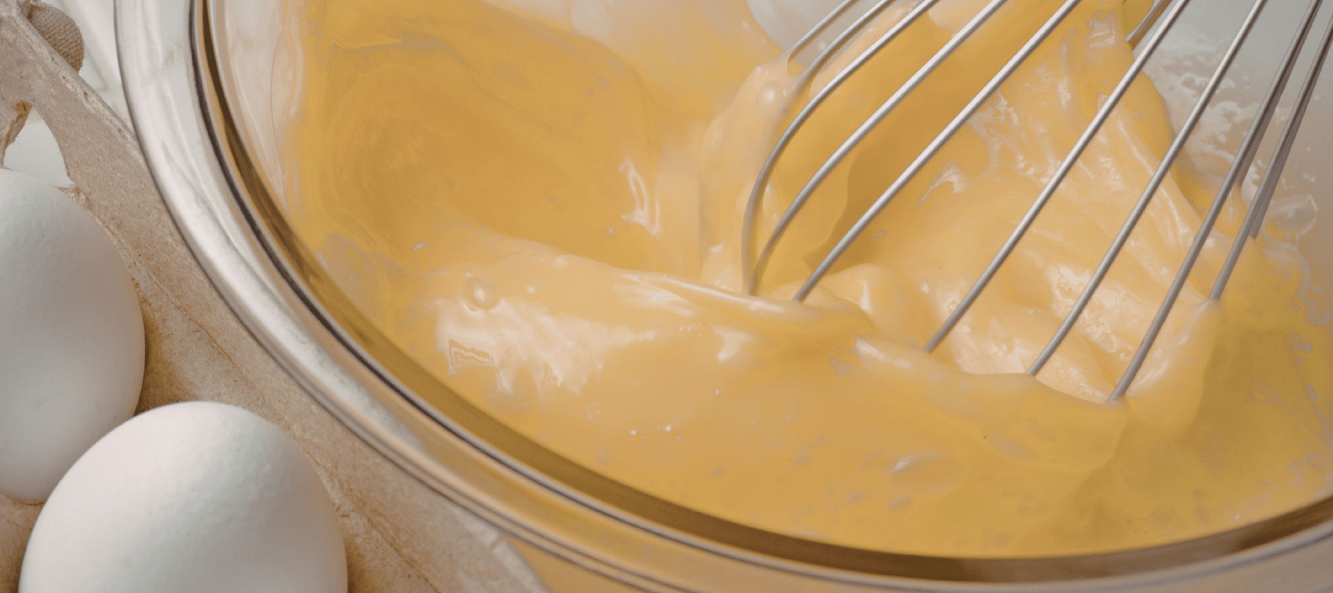 closeup of bowl of whisked eggs